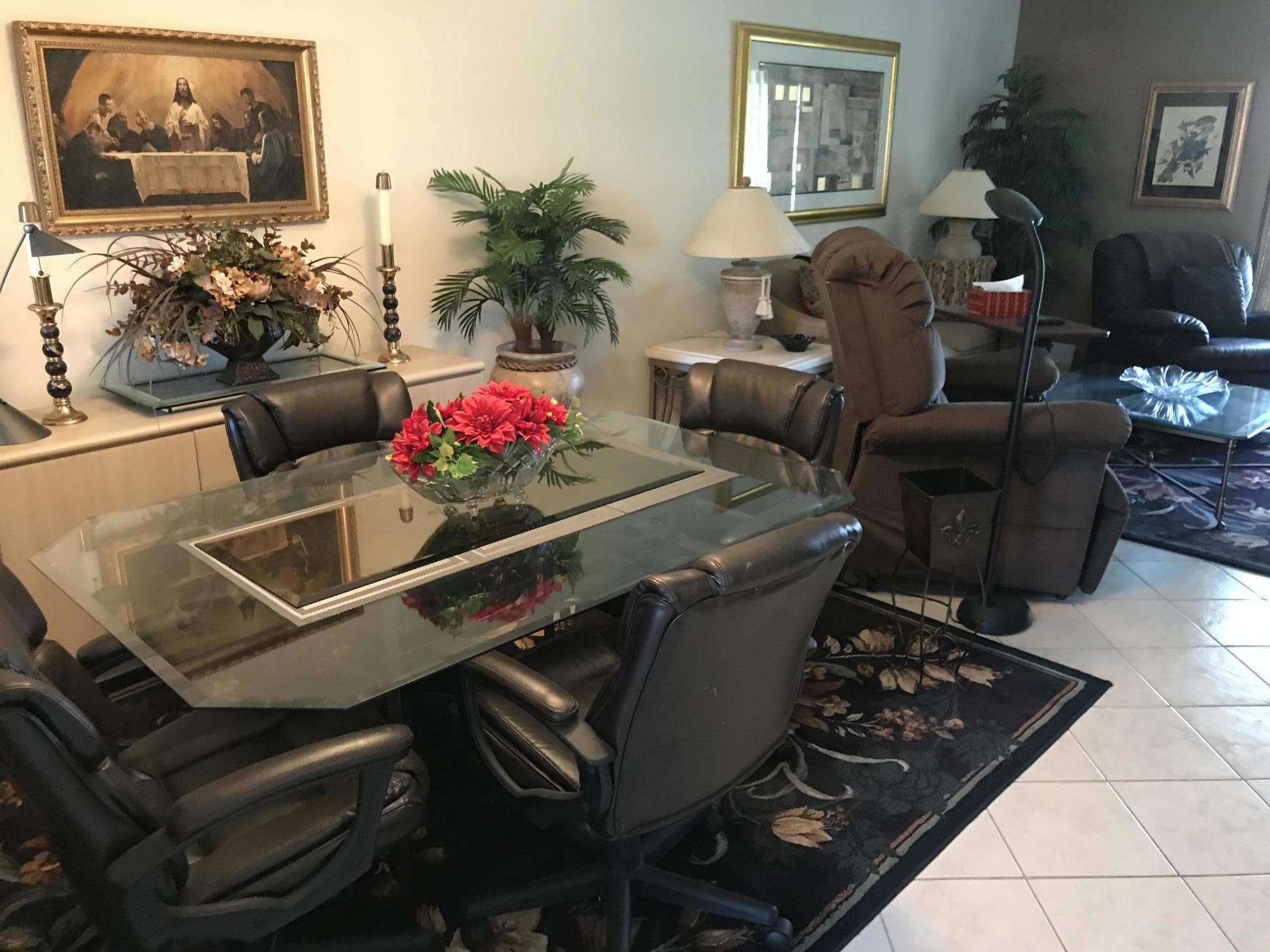 a living room with furniture and flowers