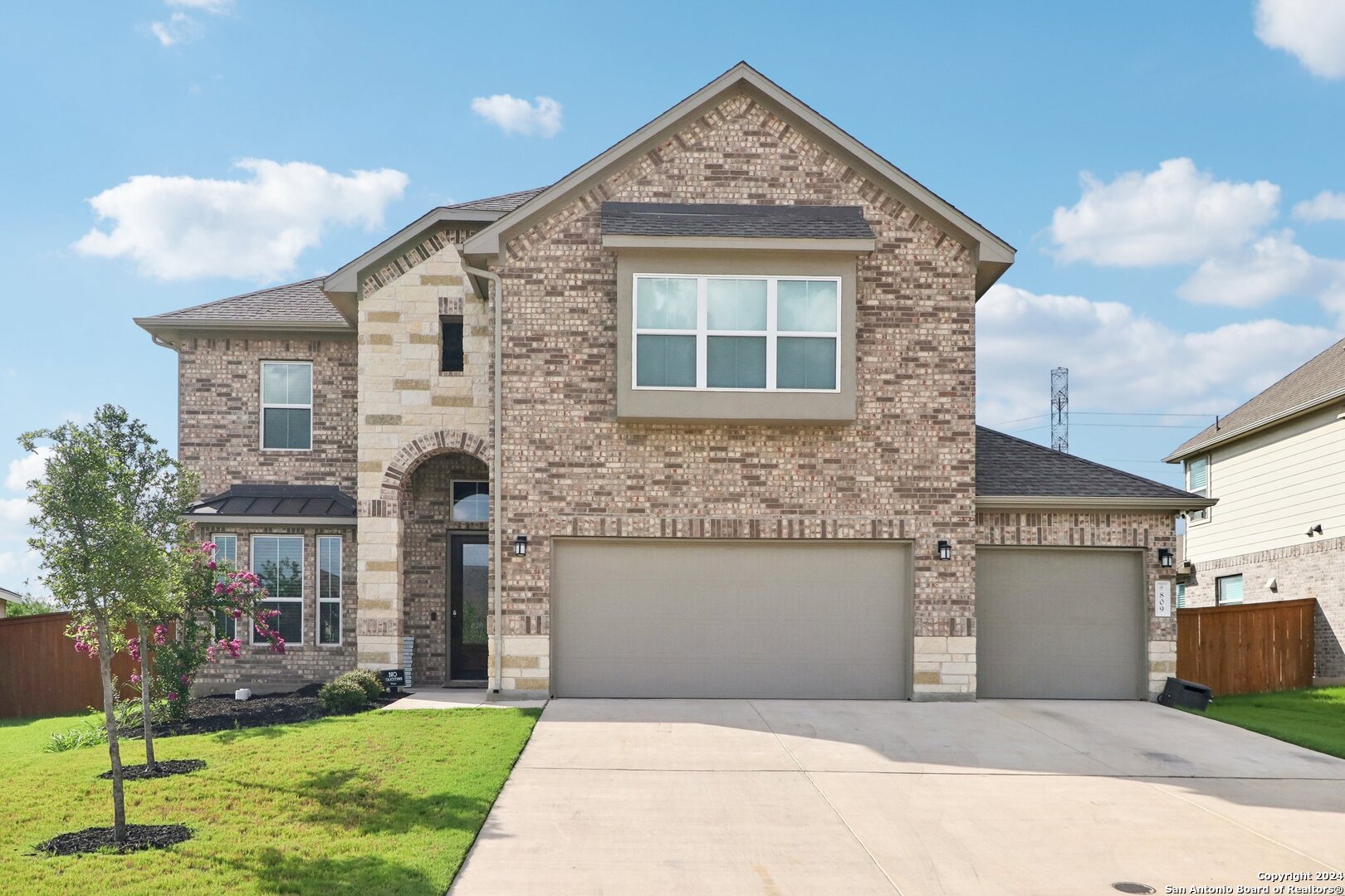 a front view of a house with a yard