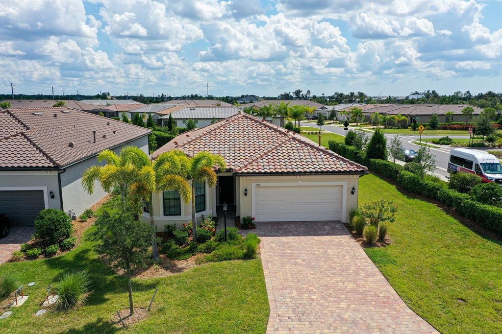 an aerial view of a house with a garden