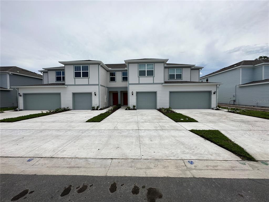 a view of house with yard