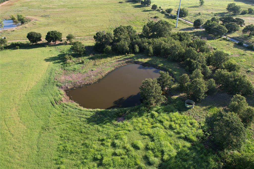 a view of a lake with a yard