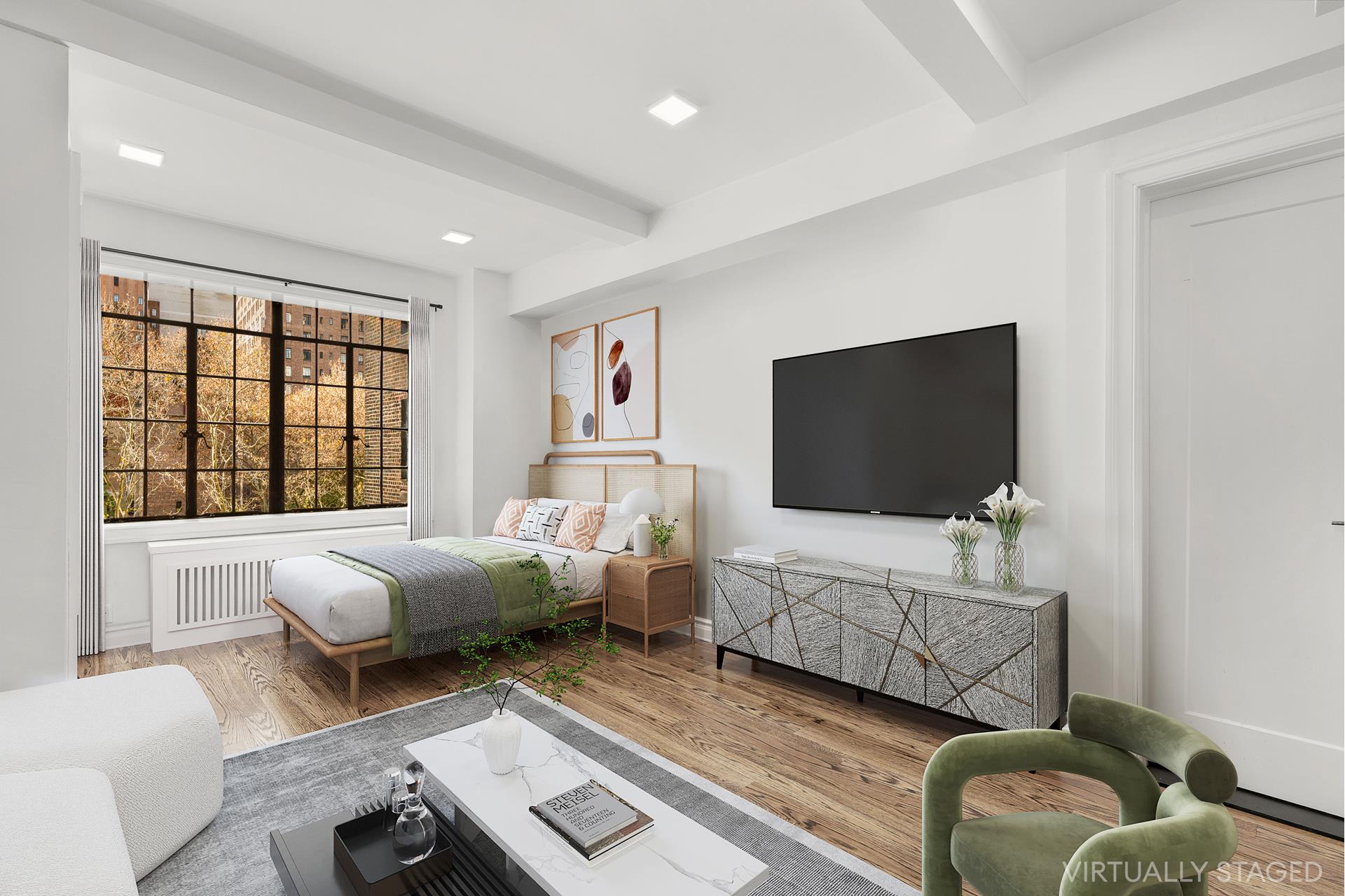 a living room with furniture and a flat screen tv