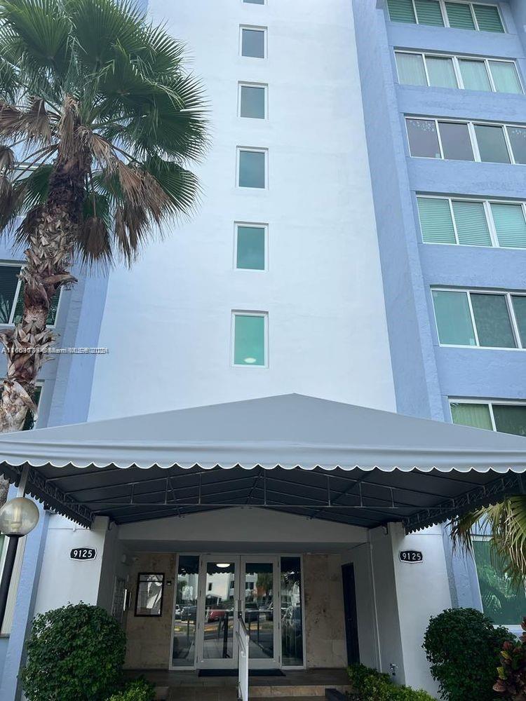 a view of a building with a window and balcony