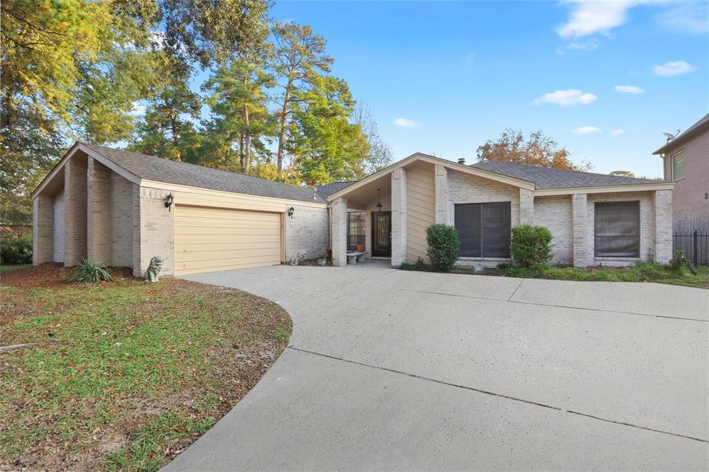 a view of a house with a yard and garage