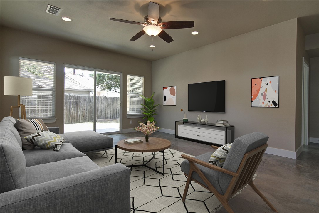 a living room with furniture and a flat screen tv