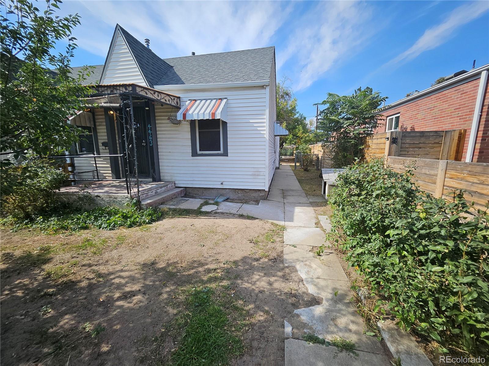 a front view of a house with a yard and a garage