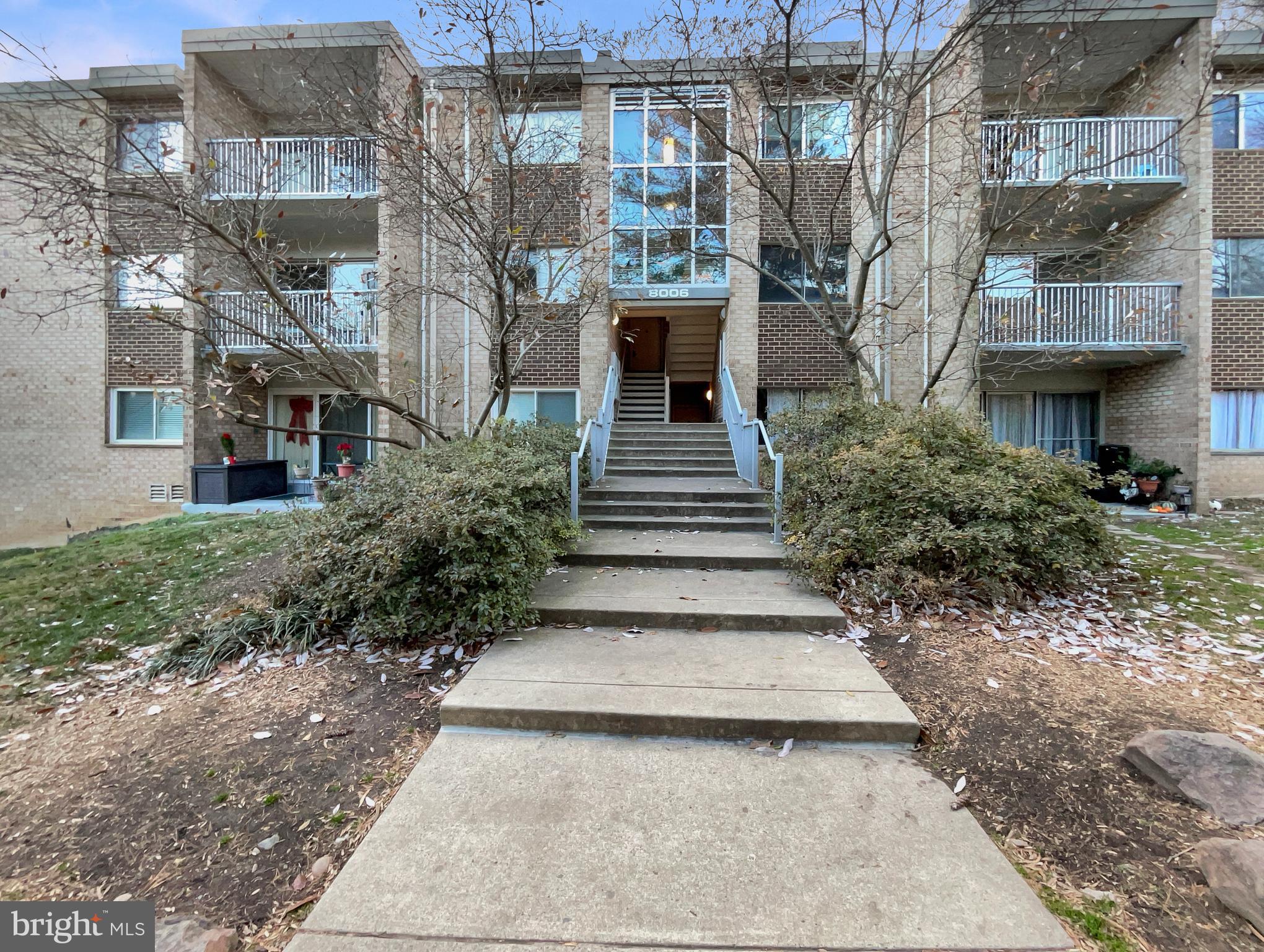 a view of a building with a yard