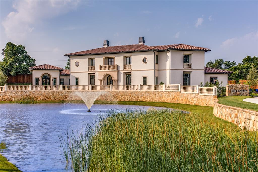 a view of an house with swimming pool and porch