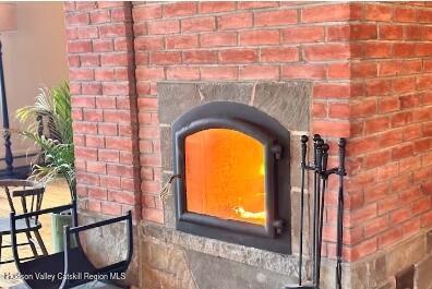 a close view of a fireplace and a table in a lobby