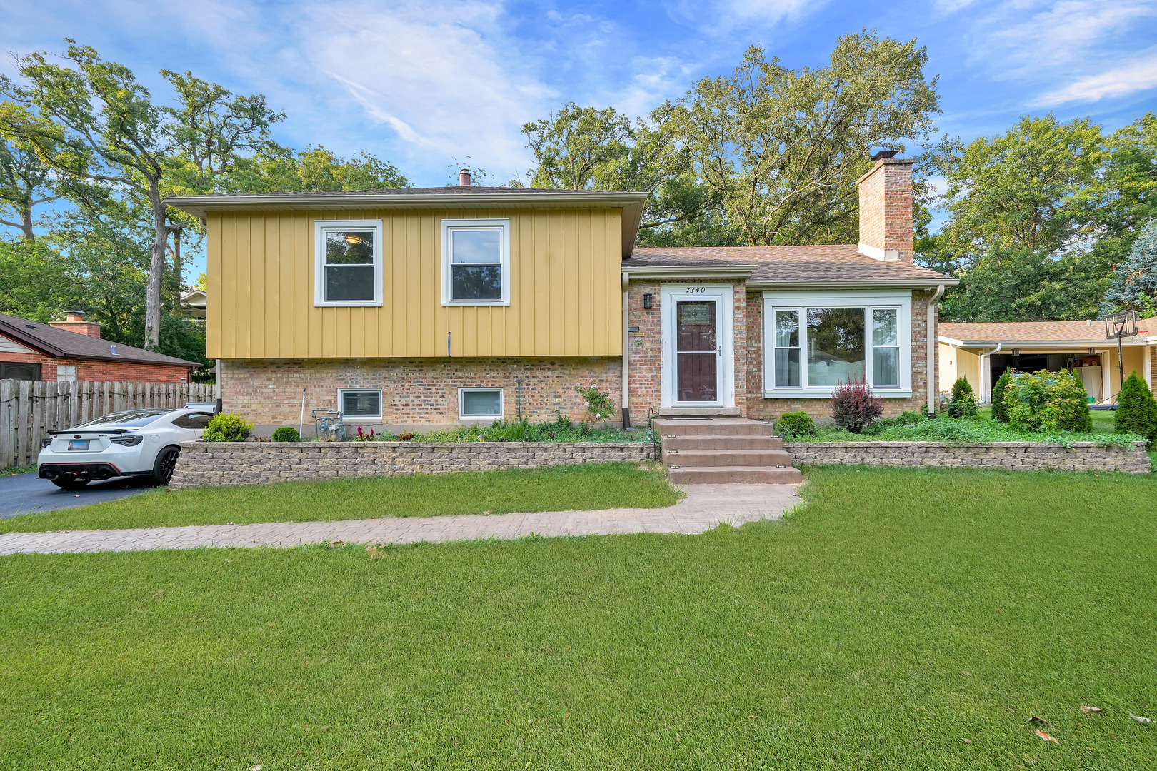 a view of a house with a back yard