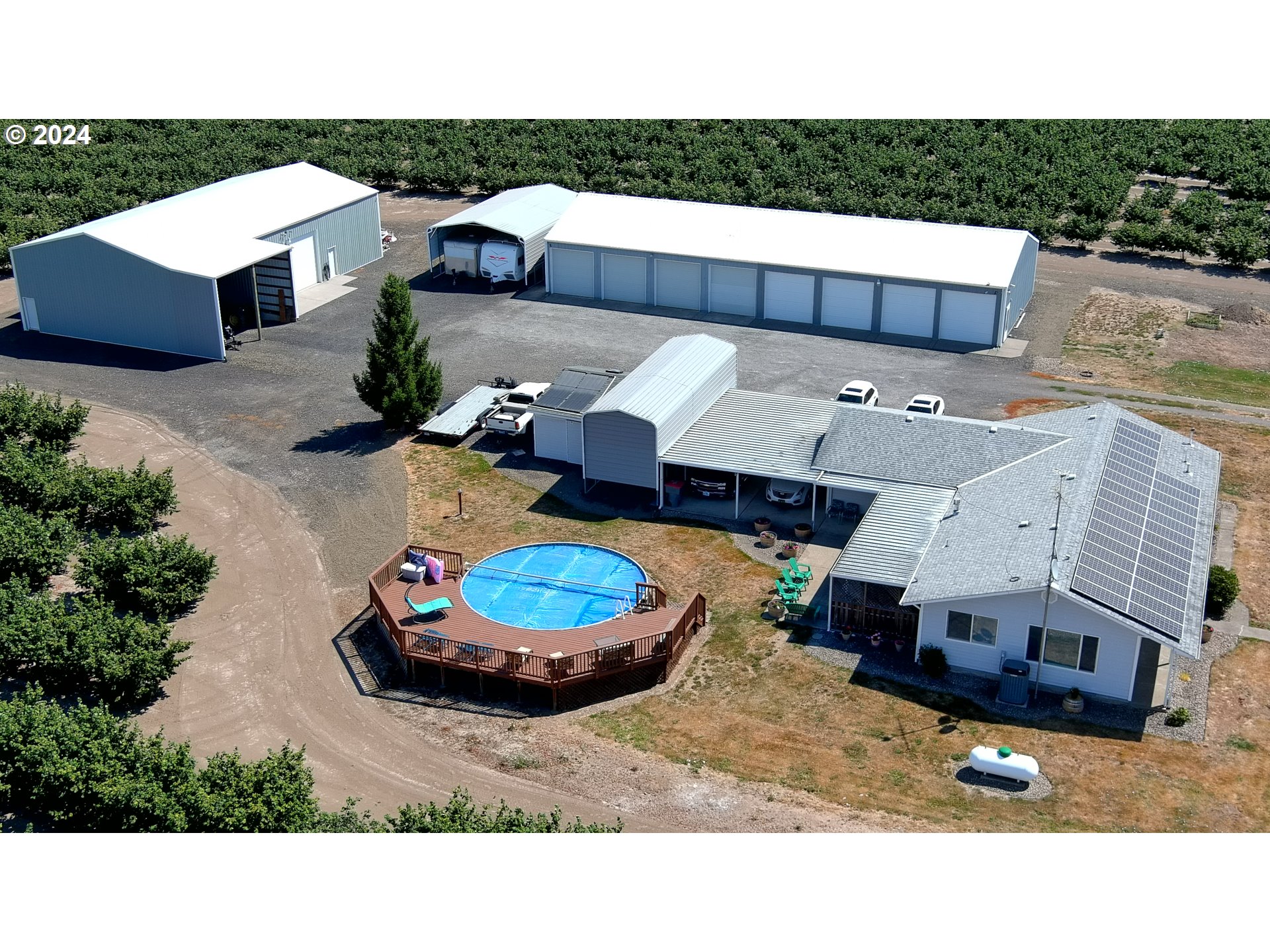 a aerial view of a house with a yard