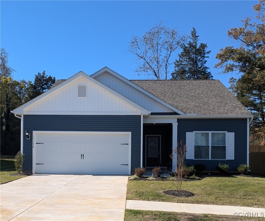 View of front of house featuring a garage and a fr