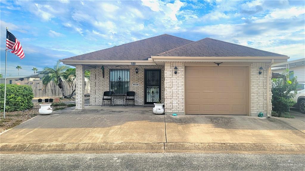 View of front facade featuring a garage