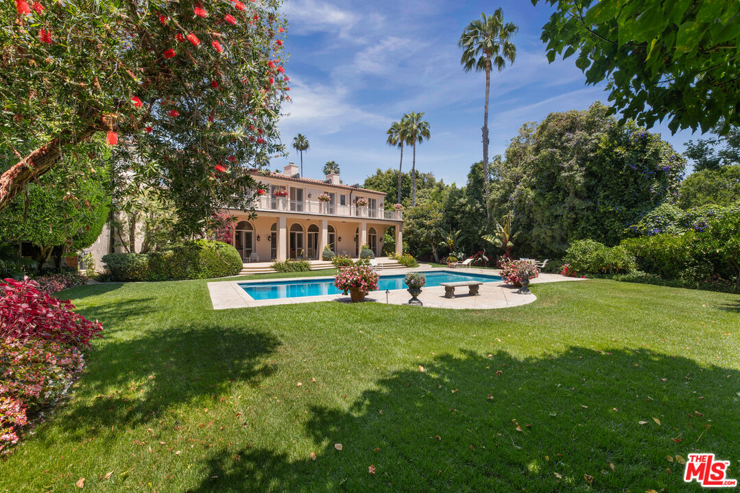 a view of a house with a backyard porch and sitting area