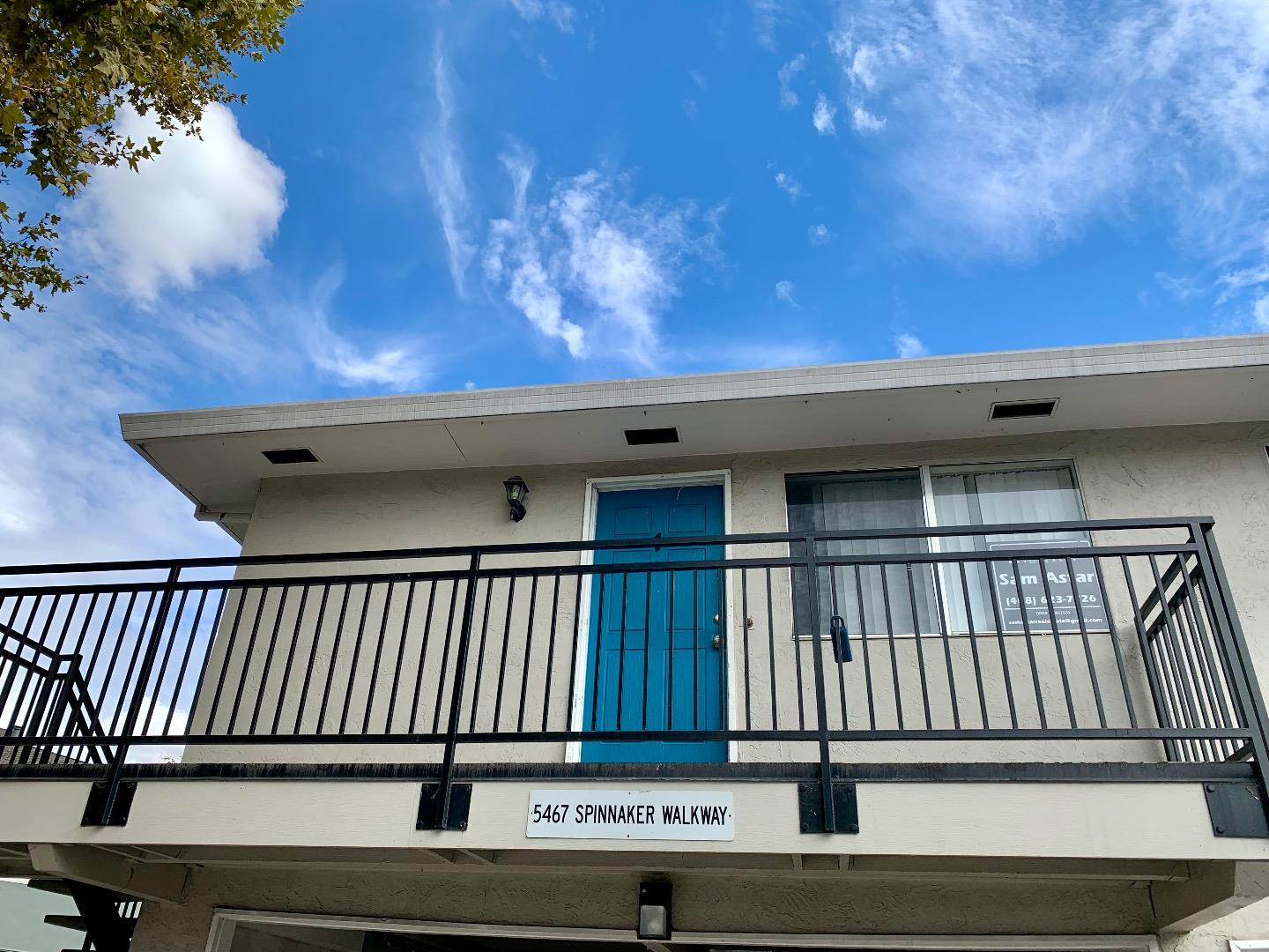 a view of balcony with a small yard