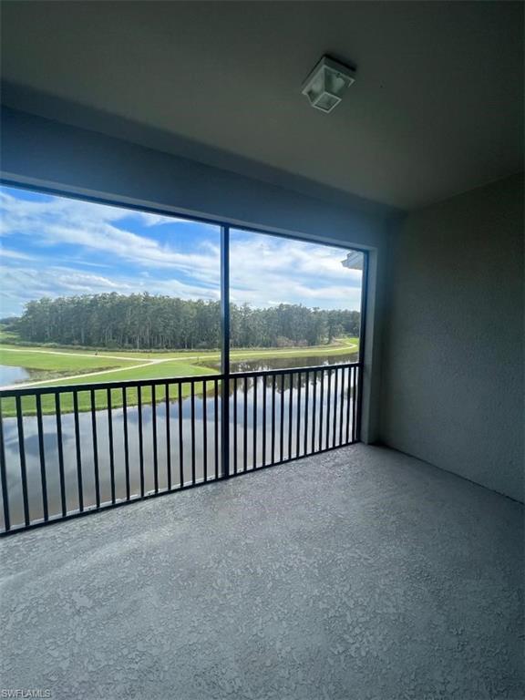 a view of a balcony with floor to ceiling window and stairs