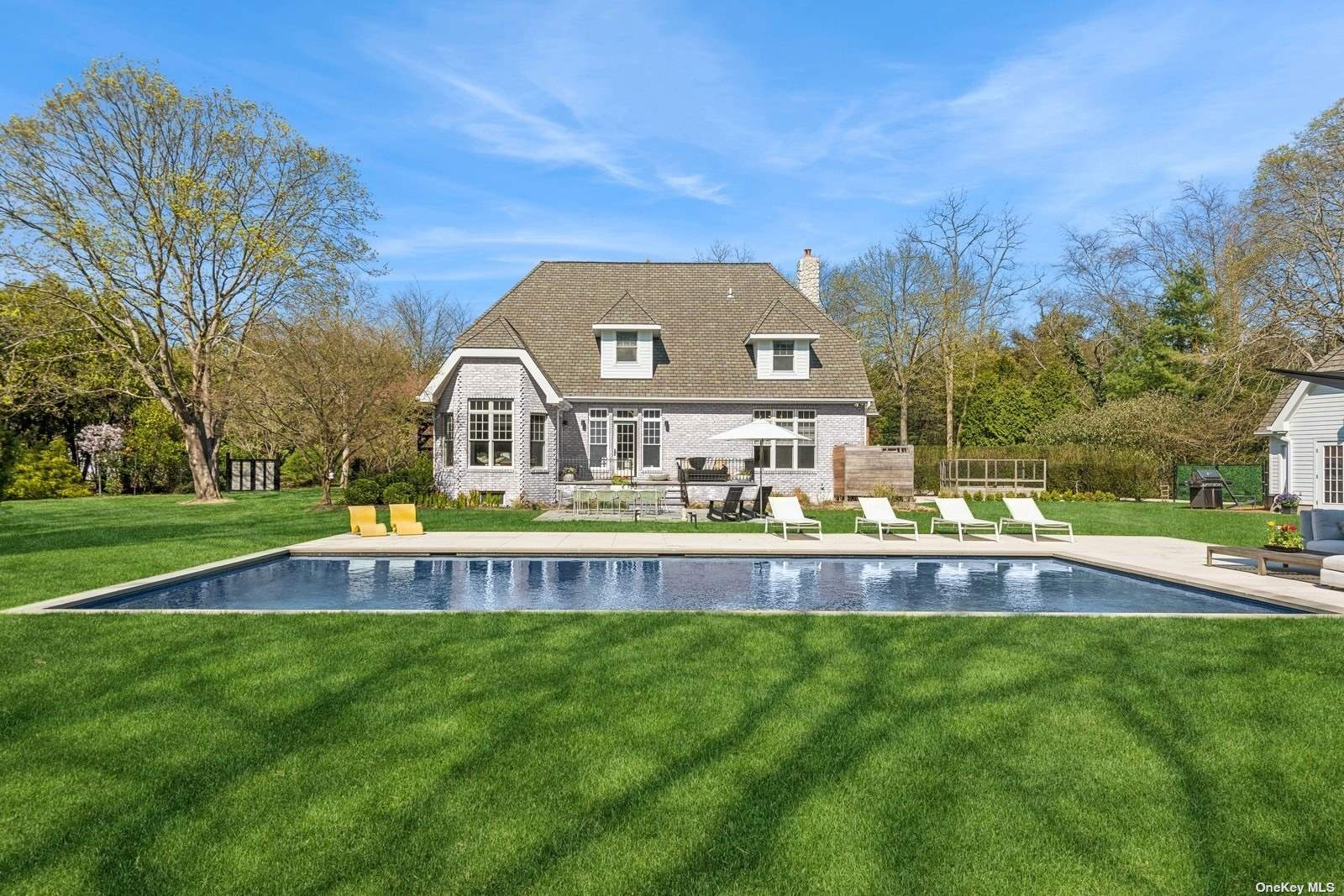 a view of swimming pool with a yard