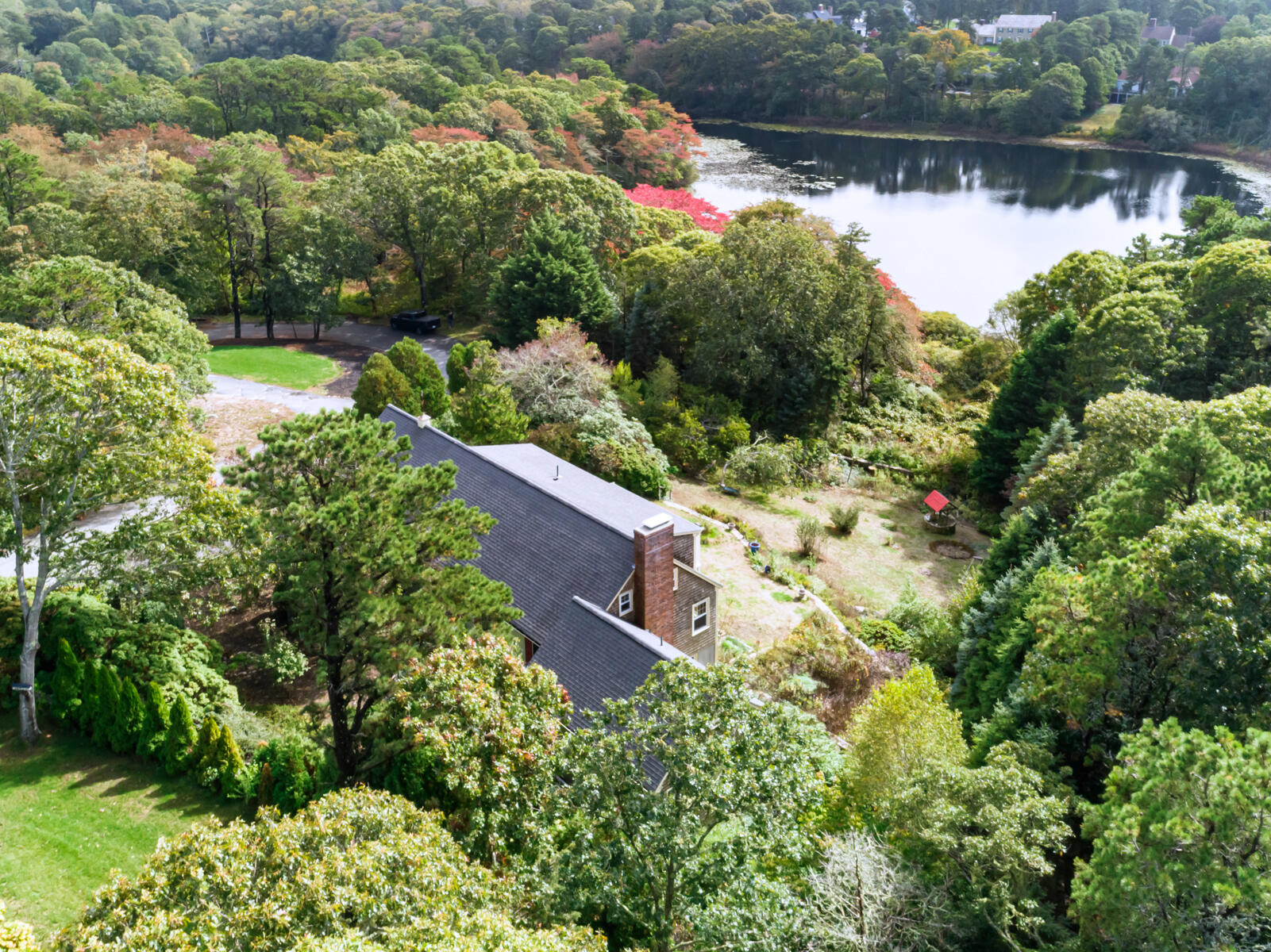 an aerial view of house with yard and outdoor seating