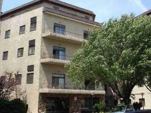 a view of a building with a tree