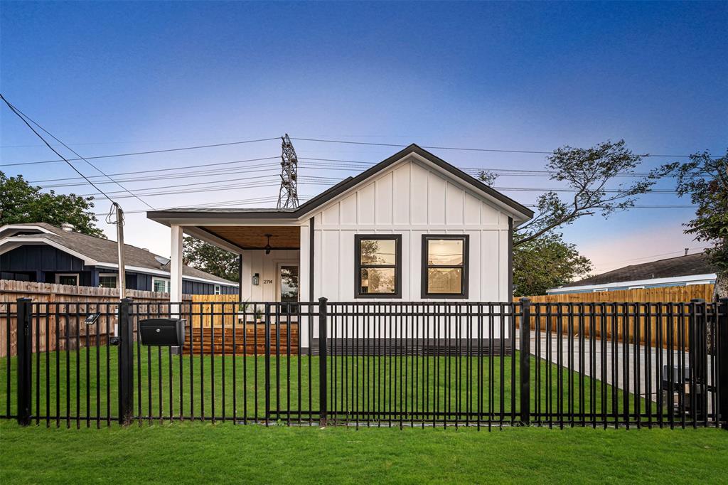 a view of a house with a wooden deck