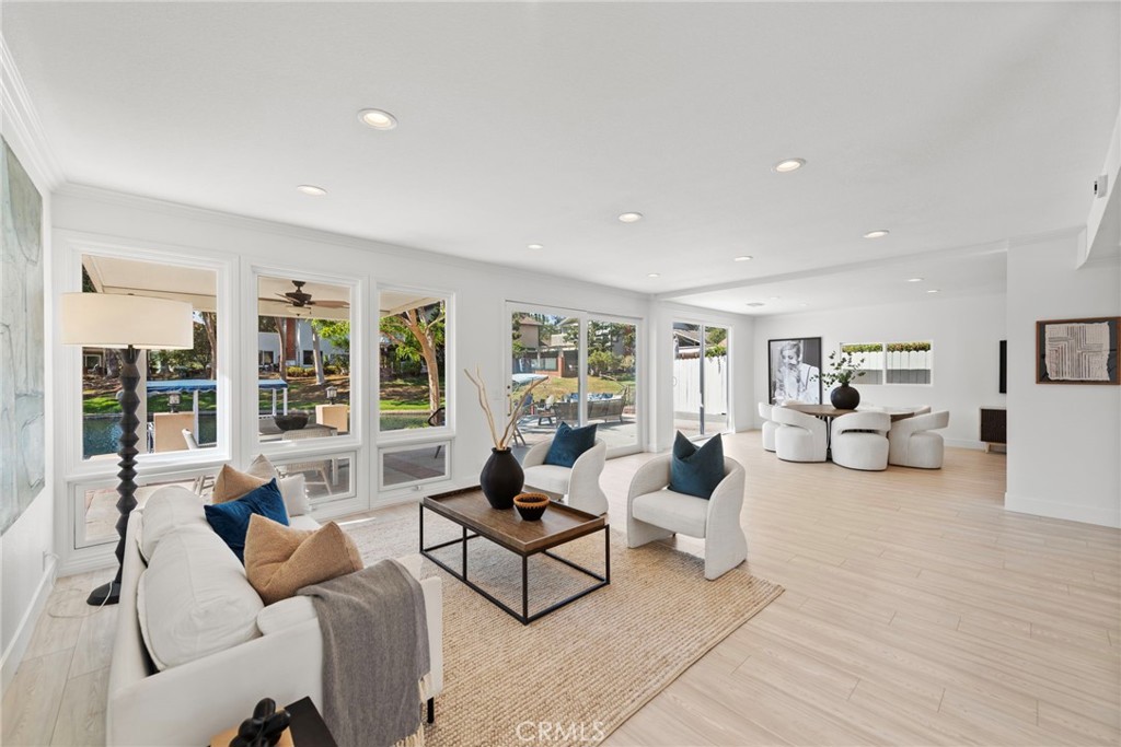 a living room with furniture and large window