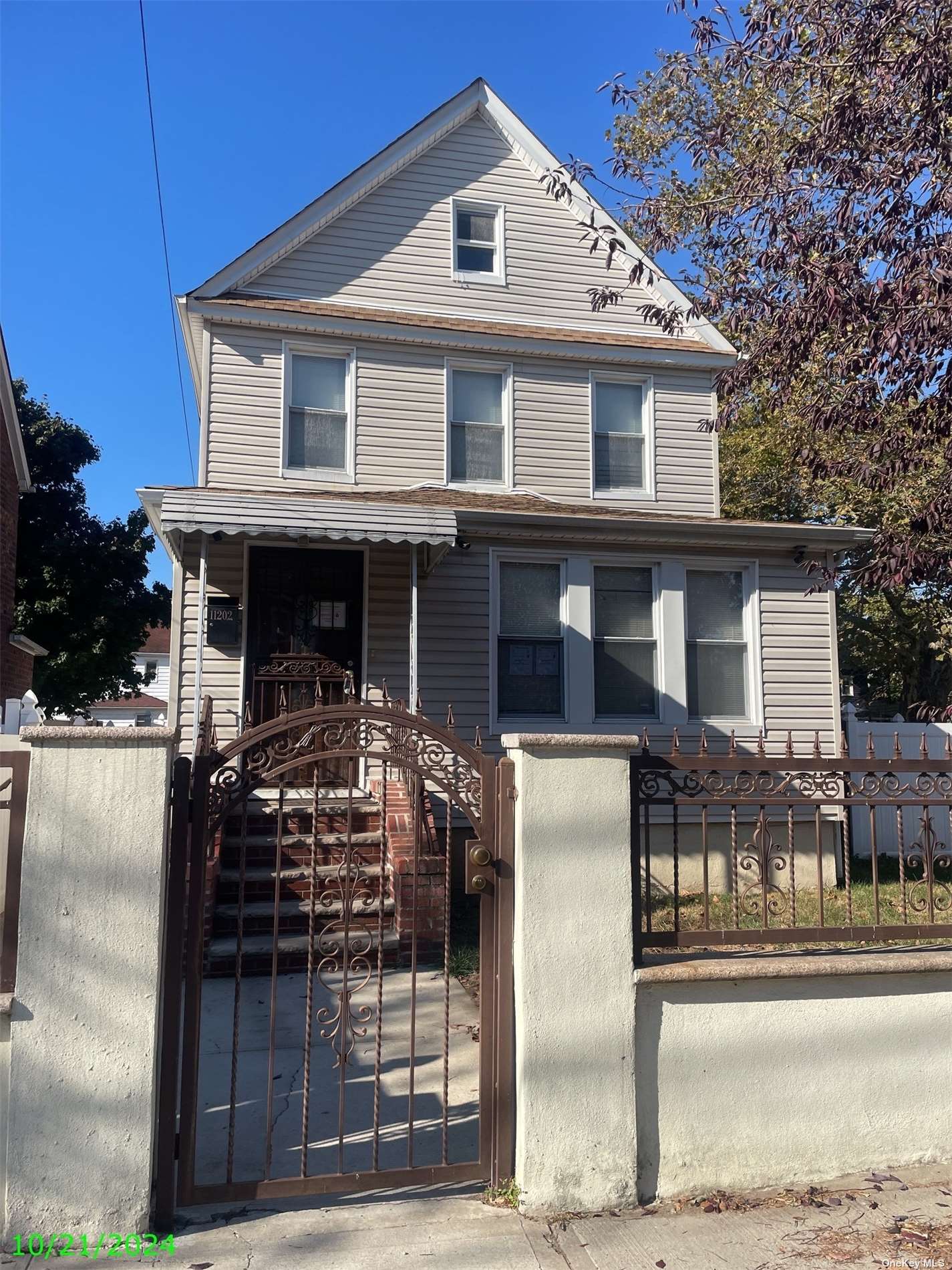 a front view of house with street