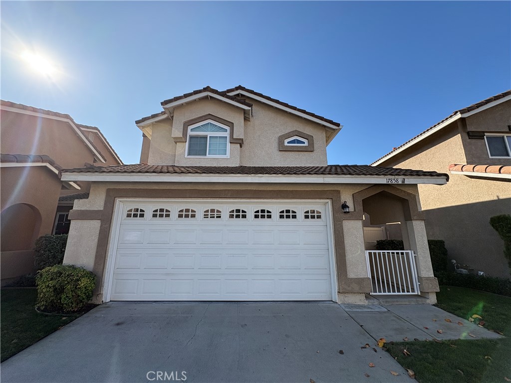 a front view of a house with garage