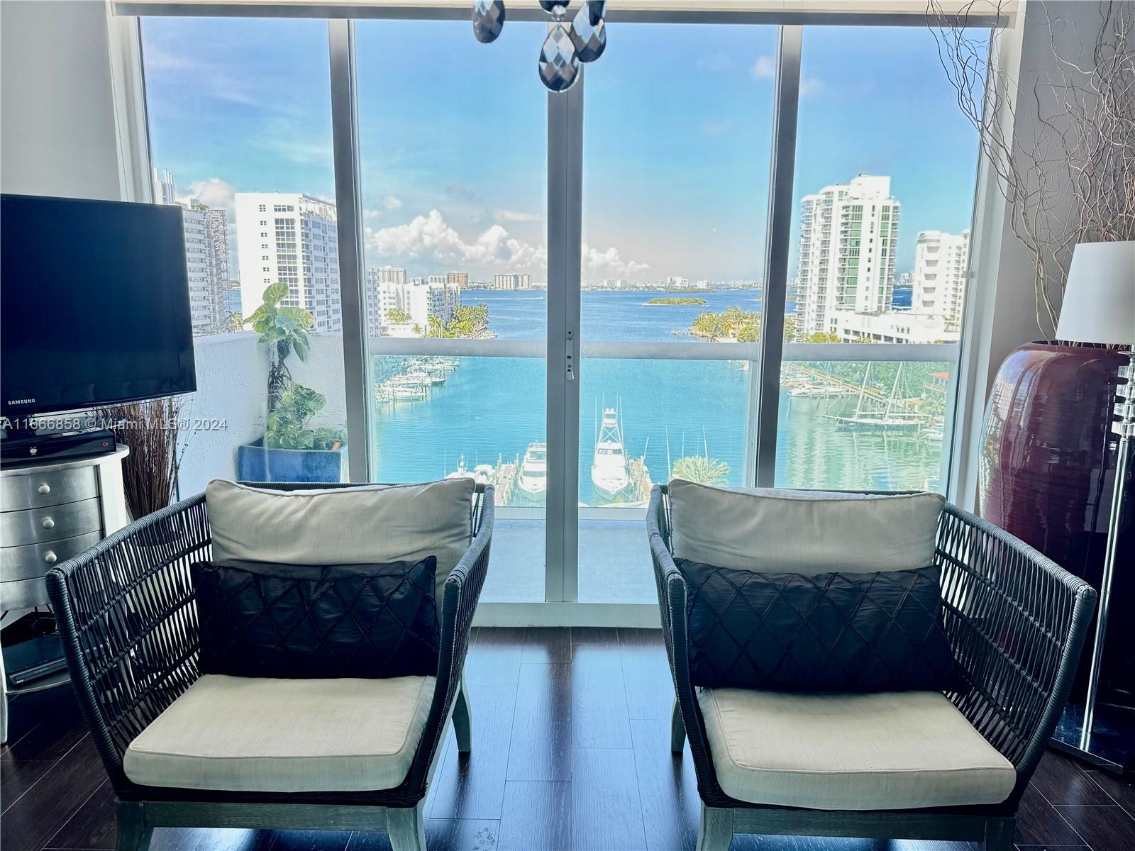 a living room with couches and a flat screen tv