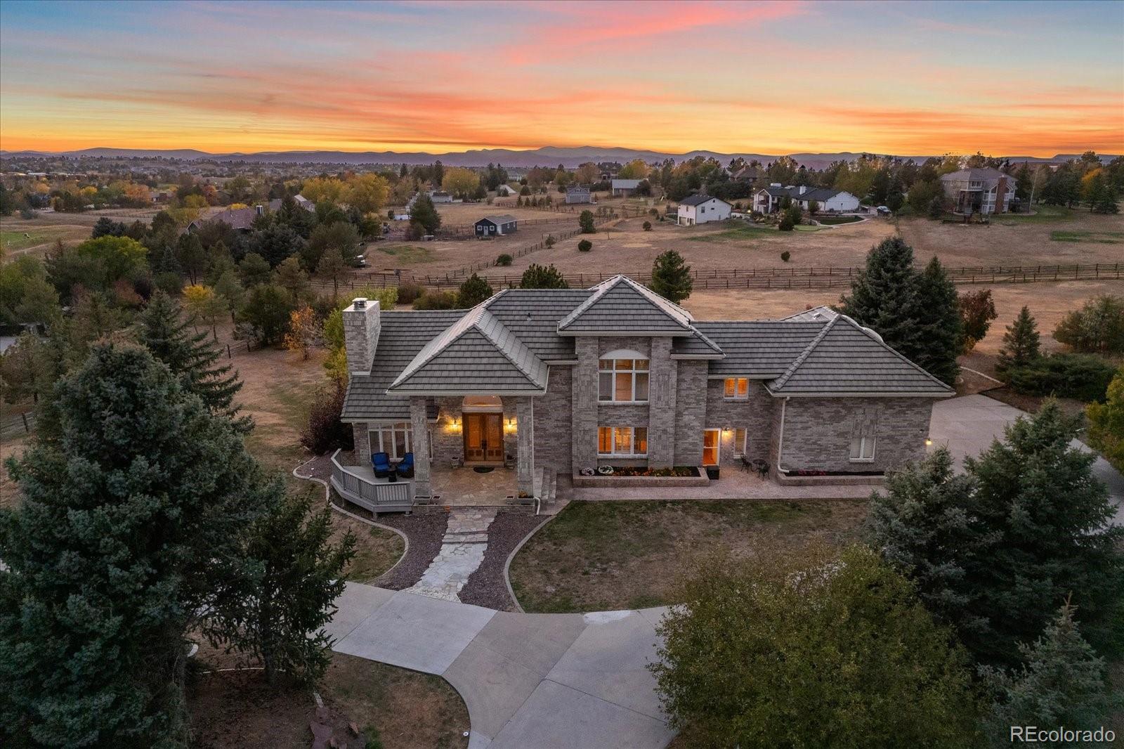 a aerial view of a house with a big yard