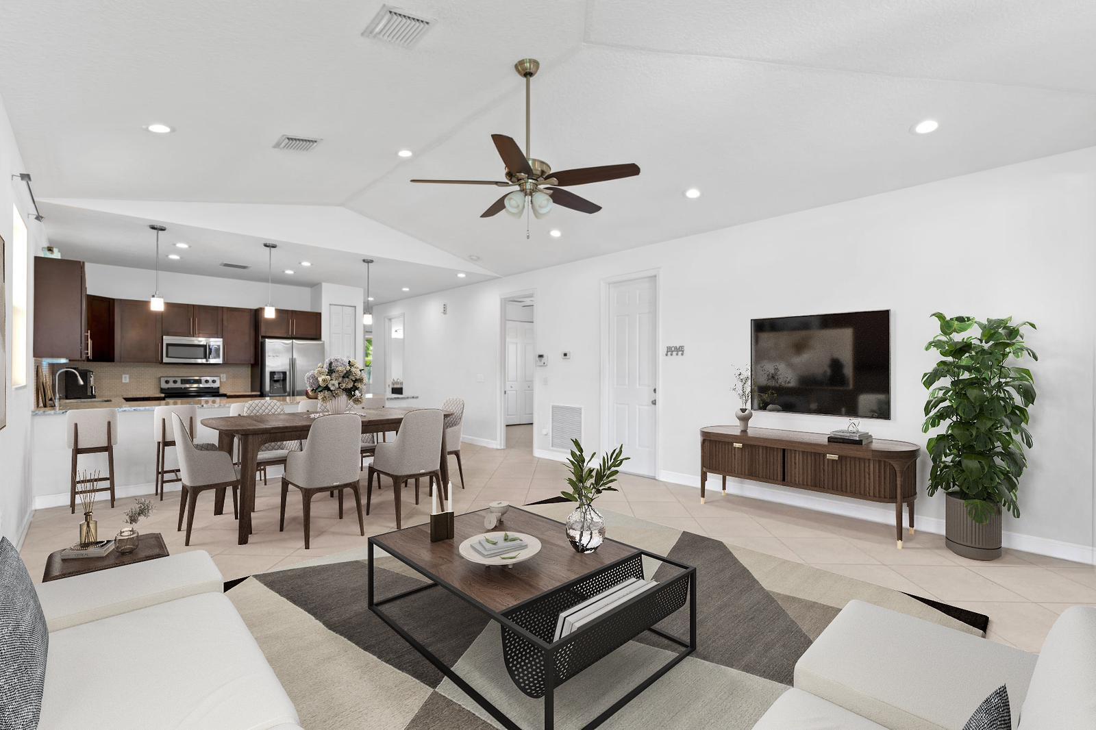 a living room with furniture and a flat screen tv