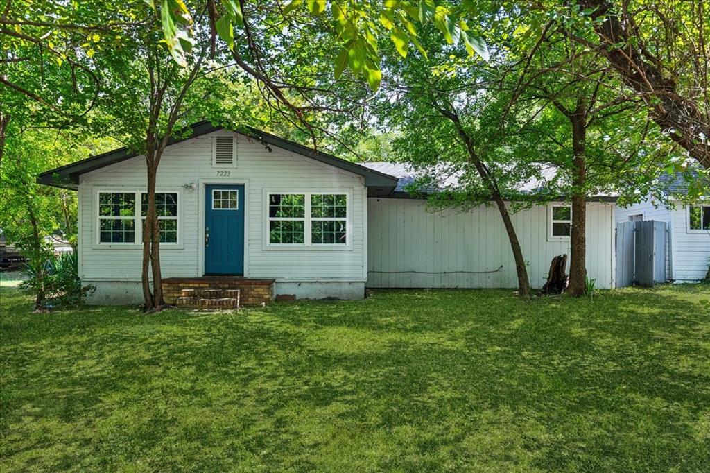 a house with a tree in front of it