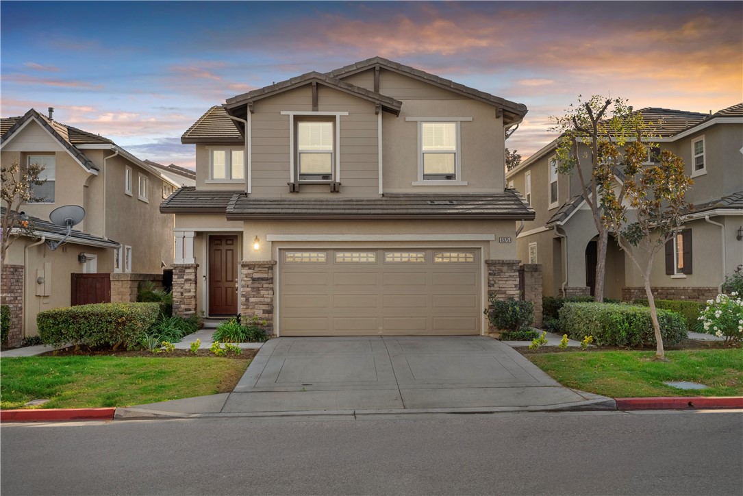 a front view of a house with garage and garage