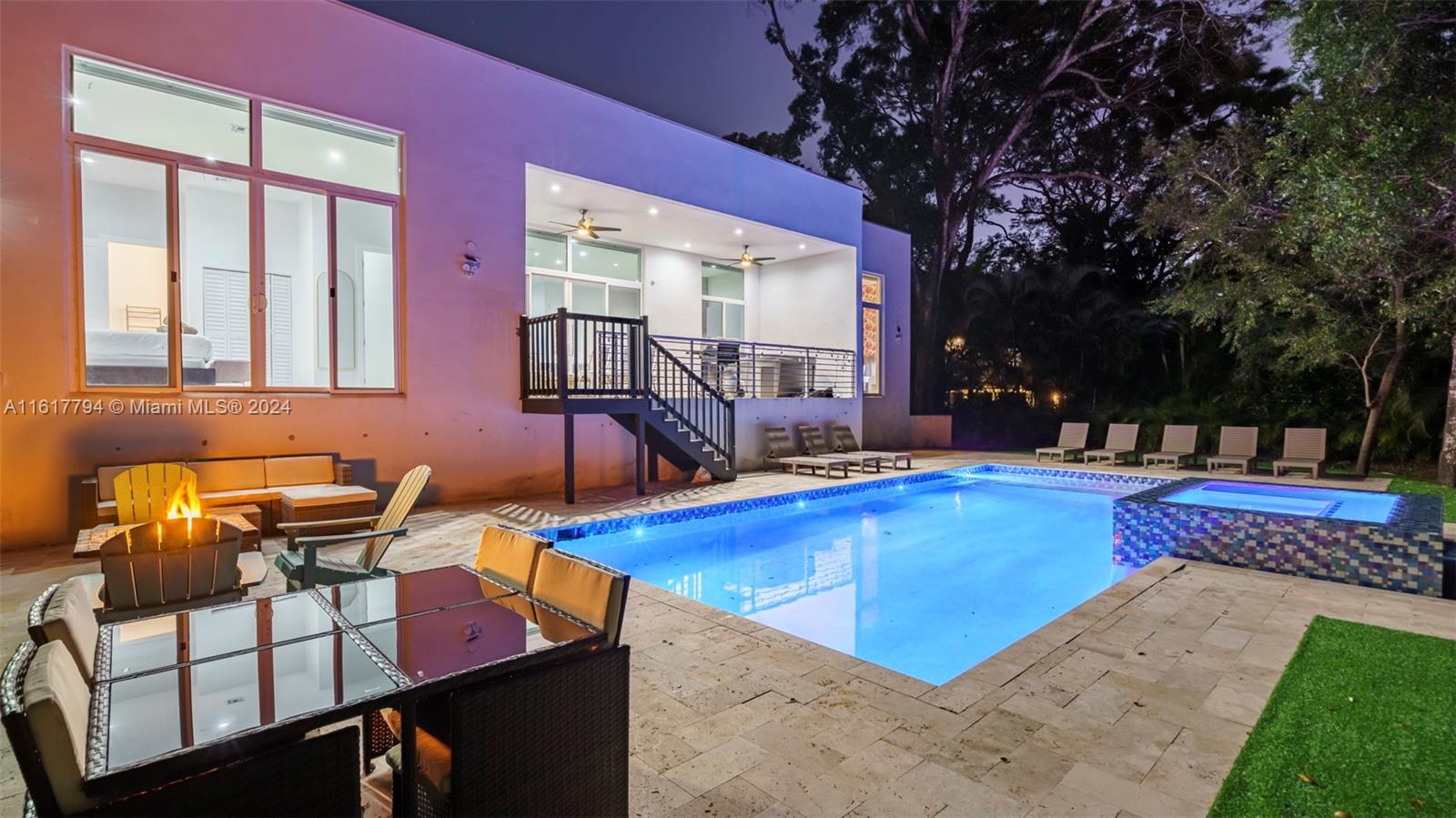 a view of a swimming pool with chairs