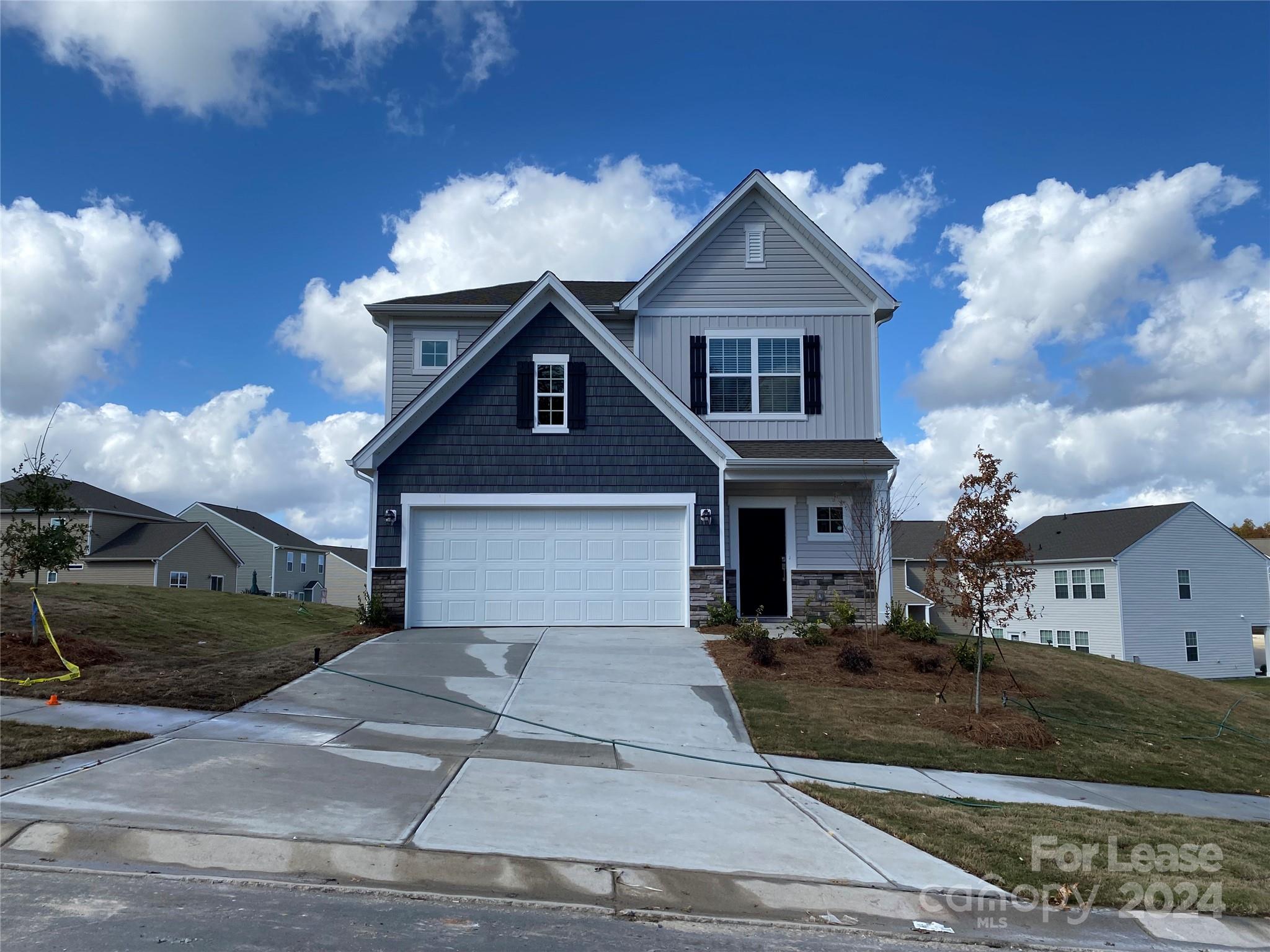 a front view of a house with yard