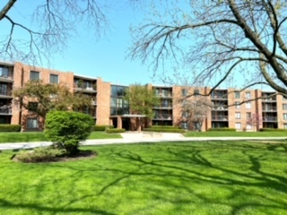 a view of a building with a yard