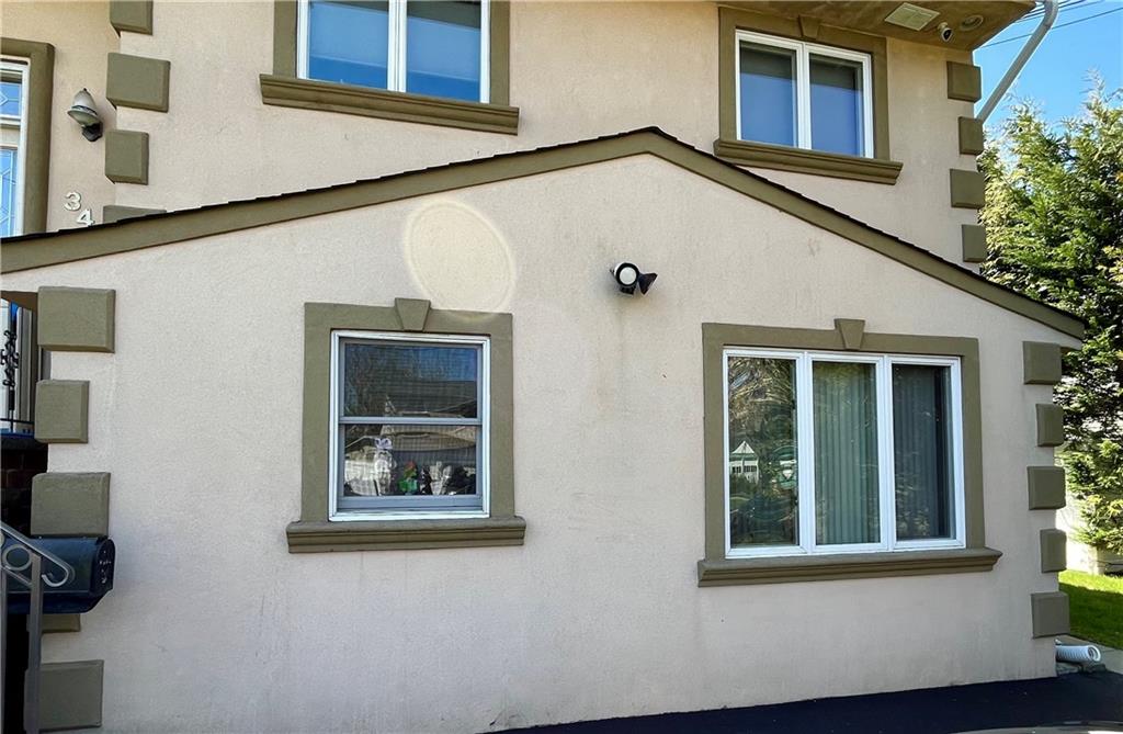 a view of a house with white door and a window