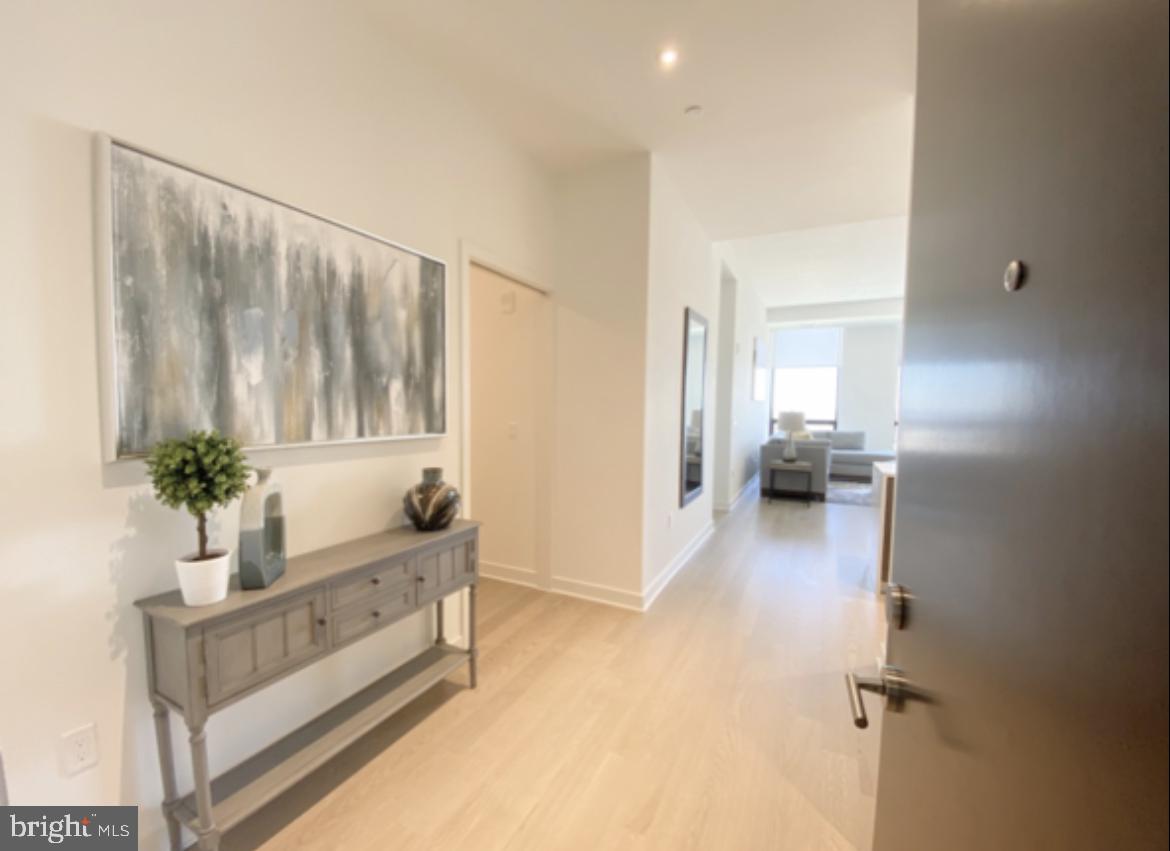 a view of an entryway with wooden floor