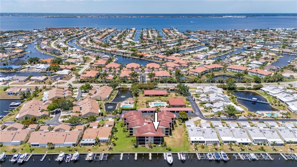 an aerial view of residential building and parking space