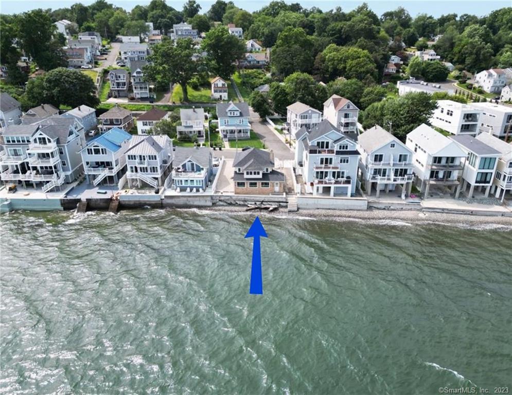 a aerial view of residential houses with outdoor space and parked