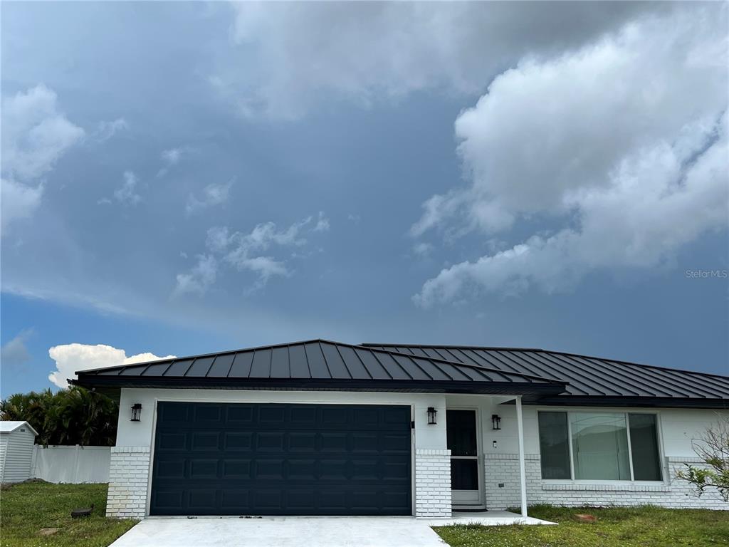 a view of a house with a garage and a garage