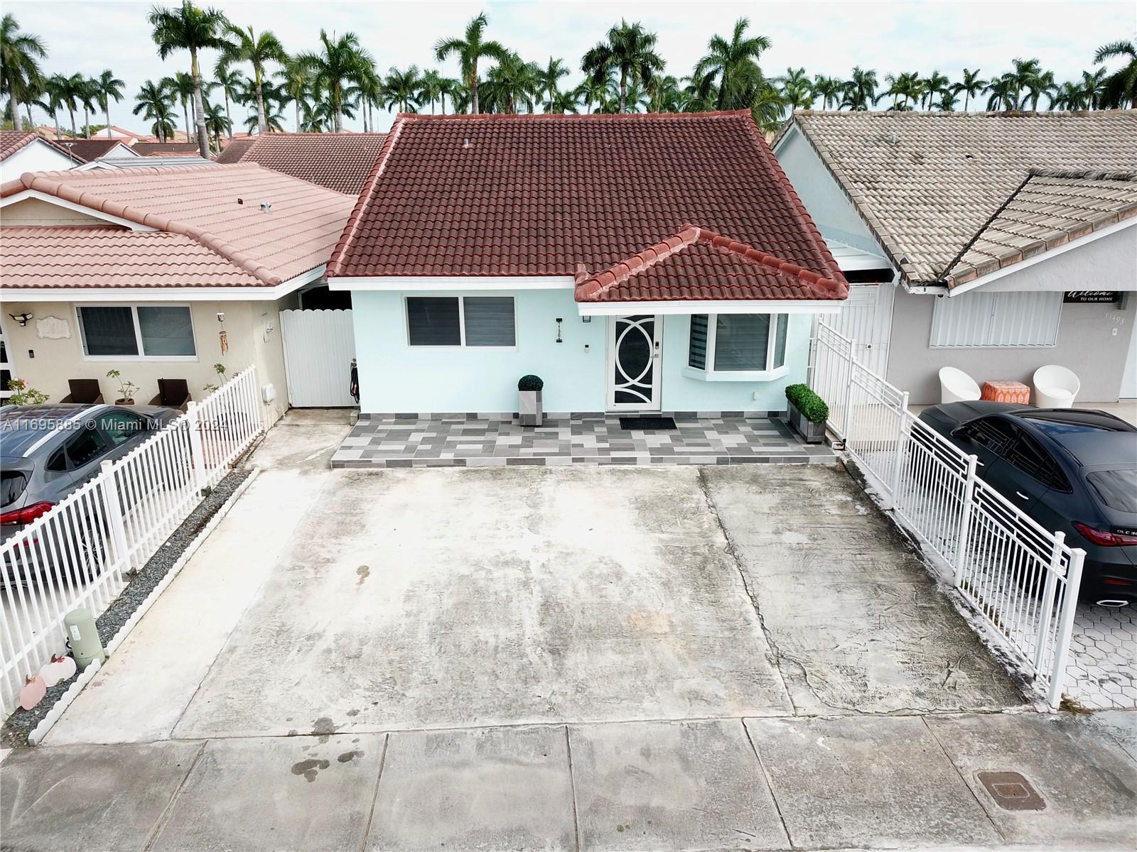 a front view of a house with parking space