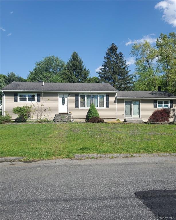 Single story home with a front lawn