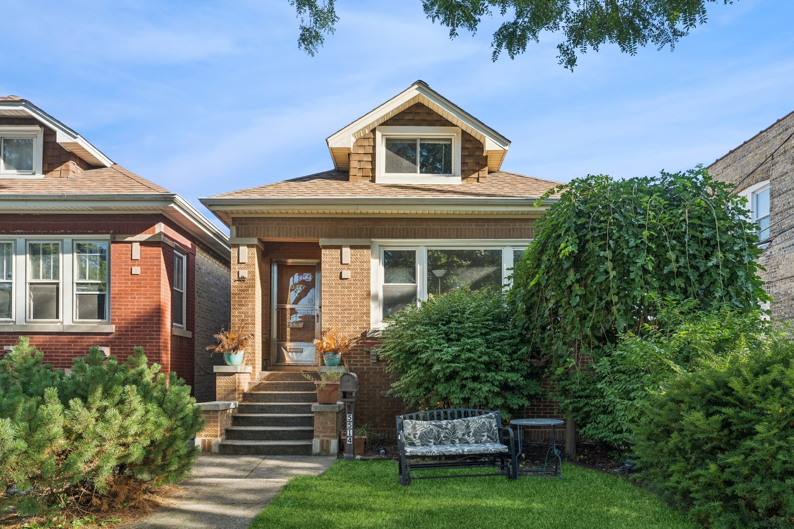 a front view of a house with garden