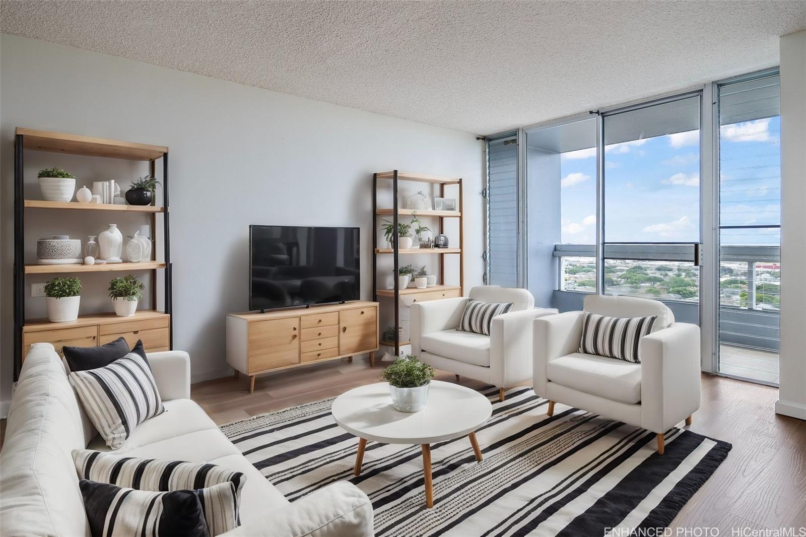 a living room with furniture and a flat screen tv