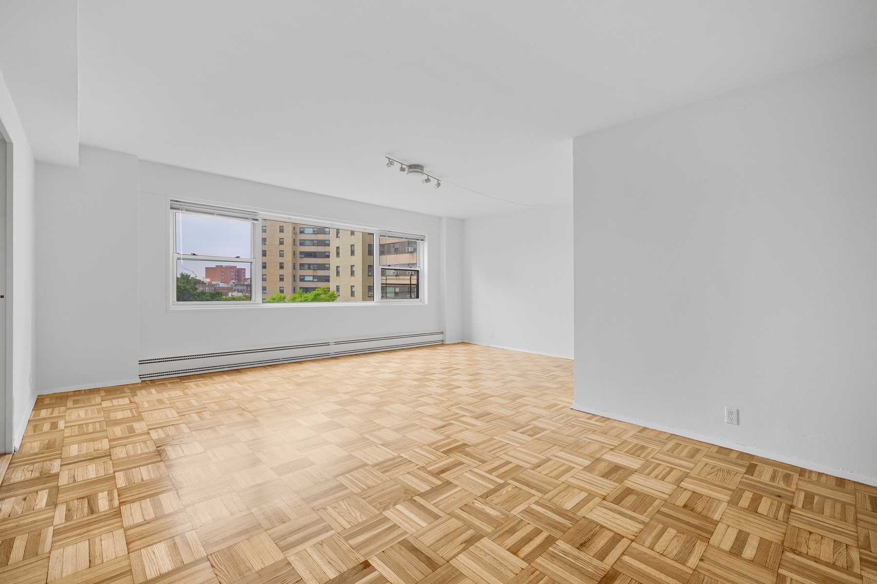 a view of an empty room with a window