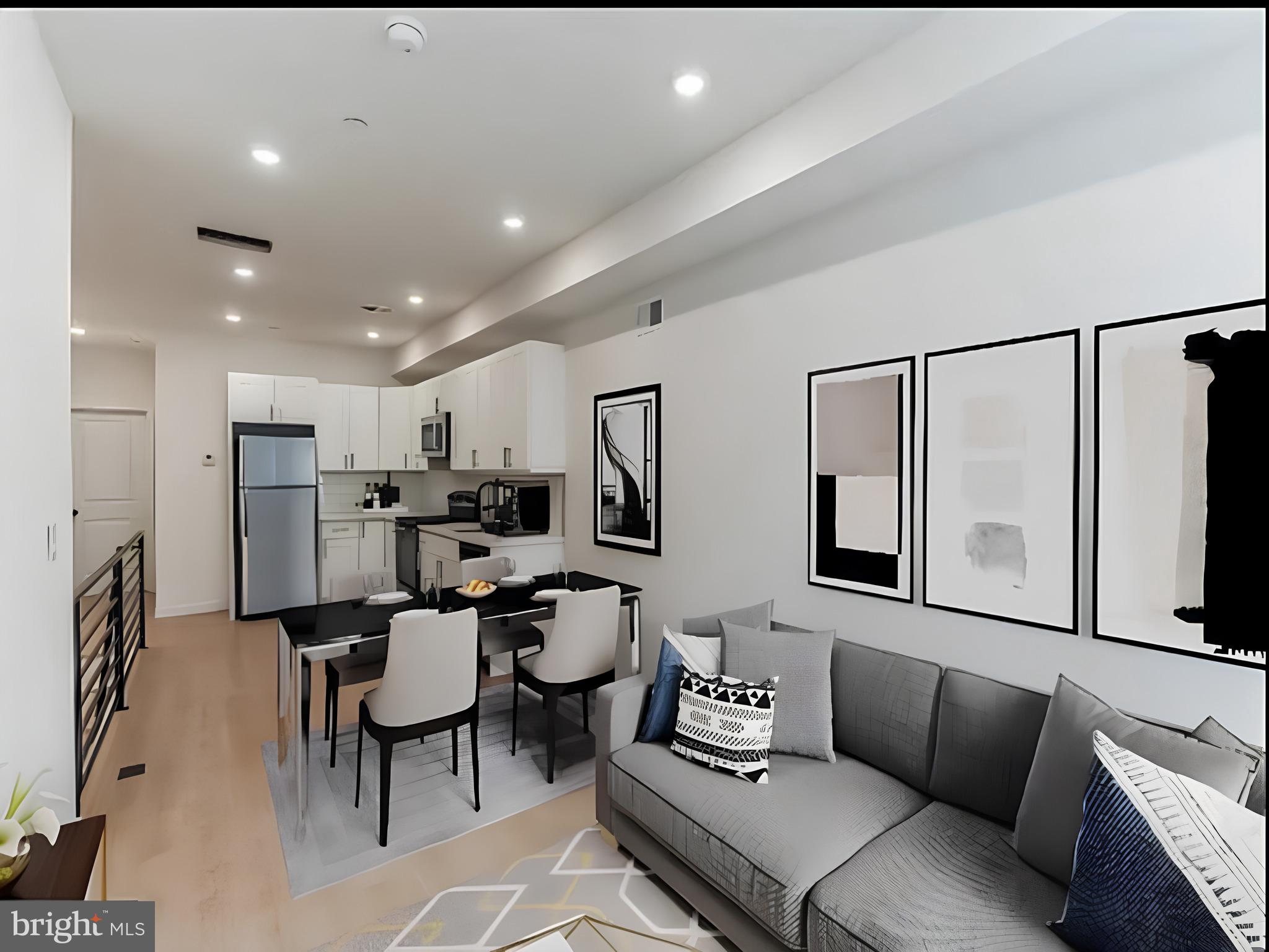 a living room with furniture kitchen view and a refrigerator