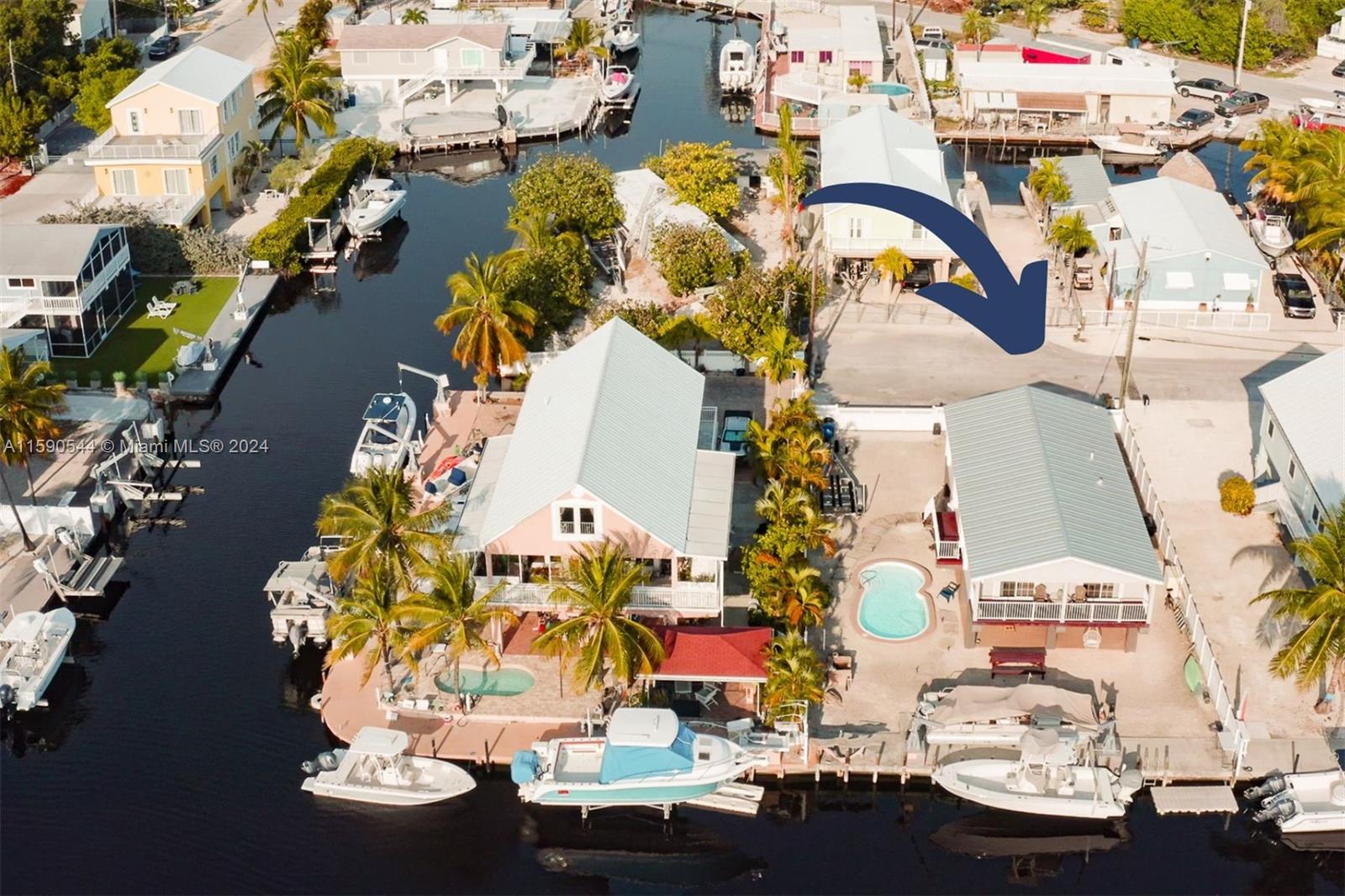 an aerial view of a houses with yard