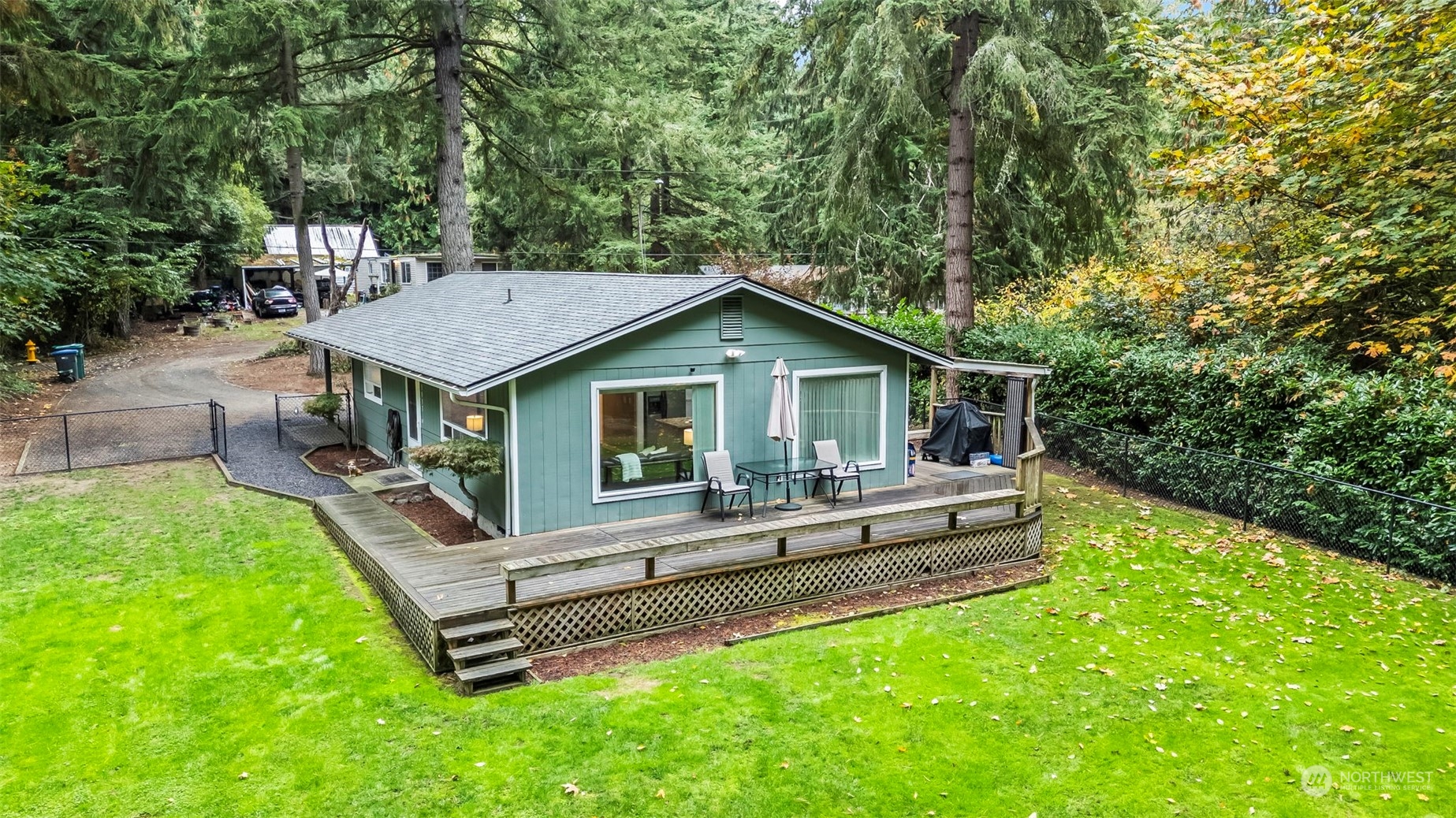 a front view of house with a garden and patio