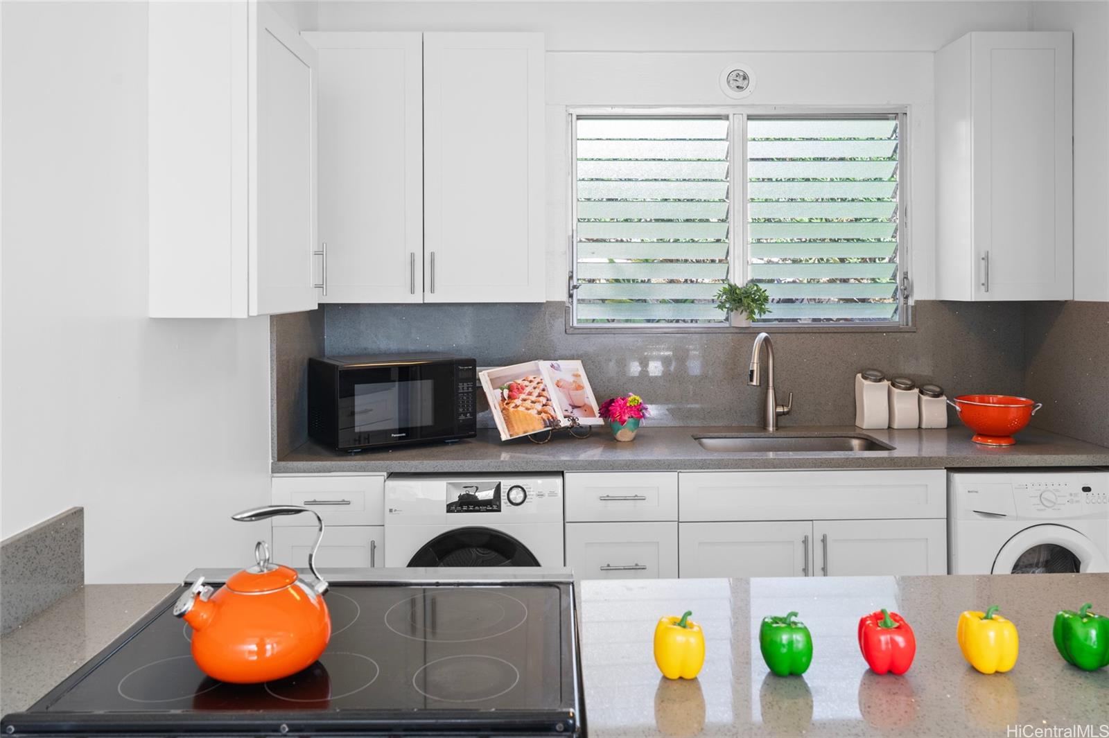 Open Kitchen remodeled 2 years ago. New 5 burner stove/oven, new dishwasher etc. Window design offers air circulation in this area.