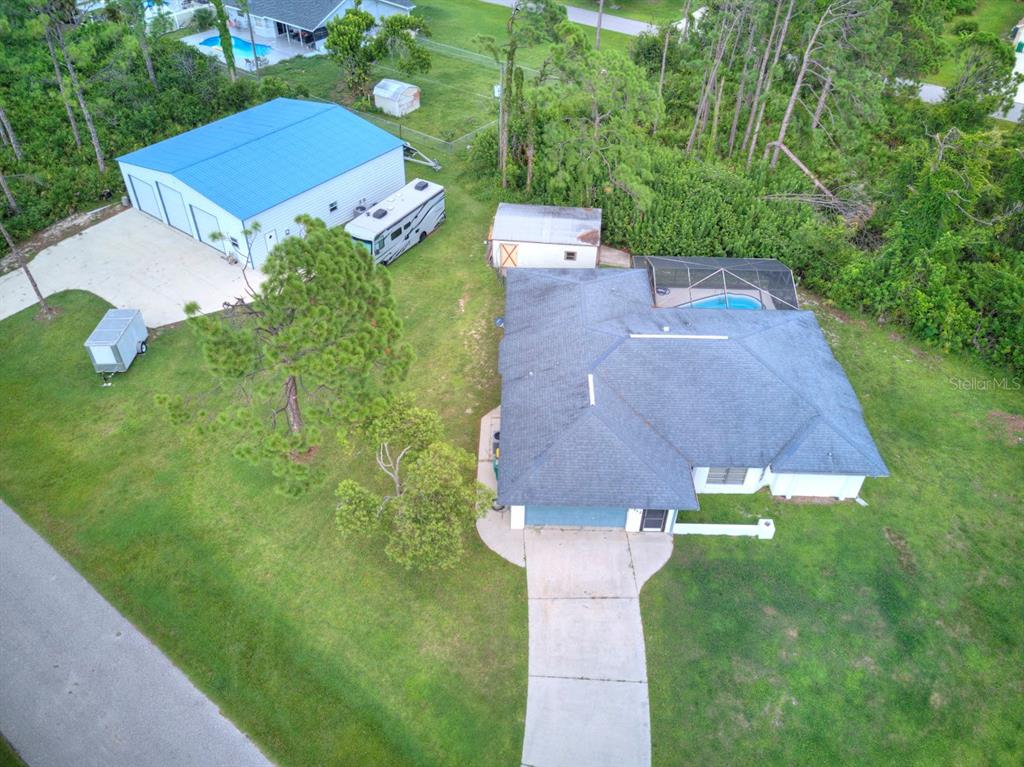 an aerial view of a house with a garden